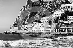 Summer resort Benidorm, Spain with beach and famous skyscrapers in the evening. Black and white