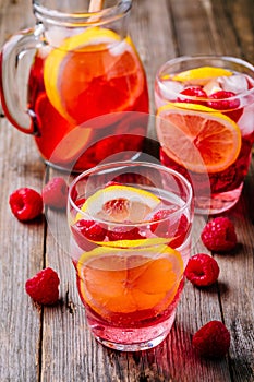 Sparkling Lemon Raspberry Lemonade Sangria in glass on wooden background