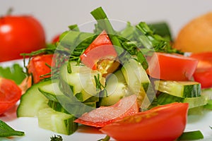 Summer salad on white plate