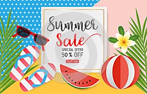 Summer sale concept for discount promotion. Colorful sandals, coconut leaves, sunglasses, beach football and plumeria flower on