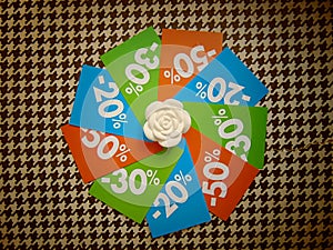 Summer sale price tags in a circle around white flower