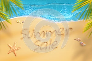 Summer sale written on beach. Summer time travel and relax