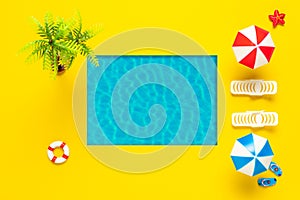 Summer scene with swimming pool, sun umbrella and sunbed. Minimal summer holiday concept background. Tropical party top view