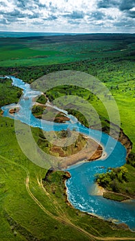 Summer scenery aerial view of winding river in beautiful valley at sunset