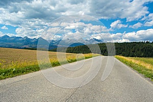 Summer scenic view of mountains and road