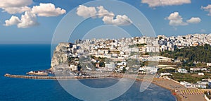 Summer sea perched Peschici beautiful town view, Gargano peninsula in Puglia, Italy. People unrecognizable