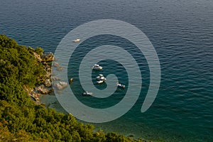 Summer sea seascape . Coastline of Stara Baska on Krk island . Ð¡ampers and caravans at the campsite.