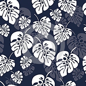 Summer seamless pattern with white monstera palm leaves on blue background