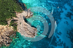summer seascape. Turquoise sea water, rocks and boats from top view, Island of sardinia in Italy. Travel backgroun