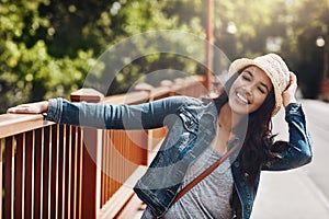 Summer is a season completely devoted to leisure. a playful young woman spending the day outdoors.