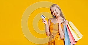 Summer Shopping. Happy Girl Posing With Credit Card And Shopper Bags