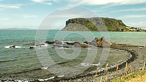 Summer shot of the nut and a pebbly beach at stanley, tasmania