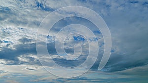 Summer sky at sunset with cirrocumulus clouds. Cloudscape in tropical summer sunlight. Timelapse.