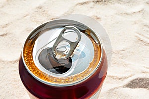 Summer soda soft drink in aluminum can. Refreshment on beach