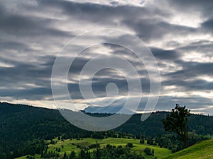 Summer in Spisz in Poland and Slovakia with view to Tatra Mountains. Dramatic sky