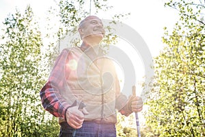 Summer sport for senior people. Nordic walking