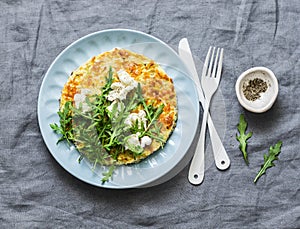 Summer squash frittata with goat cheese and arugula - delicious healthy diet food, breakfast, snack on a gray background