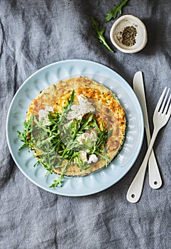 Summer squash frittata with goat cheese and arugula - delicious healthy diet food, breakfast, snack on a gray background