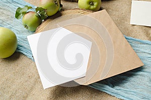 Summer stationery mockup scene with with apples, blue runner, on a beige background in rustic style and natural. Mockup card for
