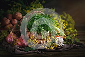 Summer still life of ripe vegetables and dill.