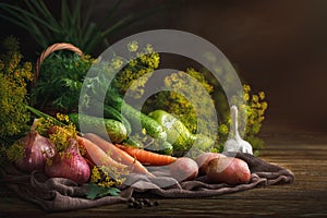 Summer still life of ripe vegetables and dill.