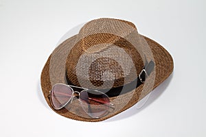 Summer straw hat with sunglases isolated o