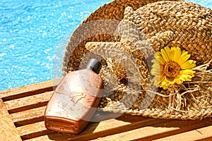 Summer straw hat with tanning lotion