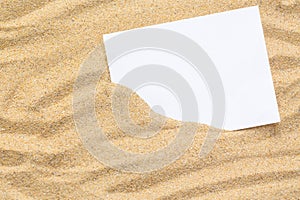 Summer style with empty blank paper on a sea sand. white card background for add text. Backdrop summer concept