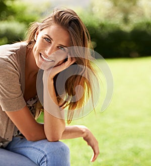 Summer sun is the best source of vitamin D. Shot of a woman enjoying the sunshine outdoors.