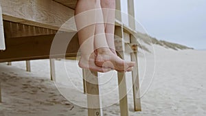 Summer sun and fun at the beach - girls relax and have a great time at the oceanfront