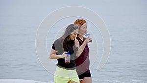 Summer Sun and Fun at the beach - girls relax and have a great time at the oceanfront