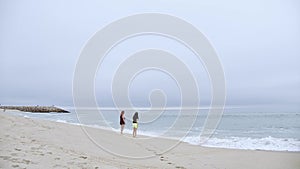 Summer Sun and Fun at the beach - girls relax and have a great time at the oceanfront