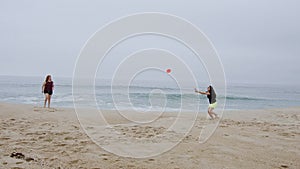 Summer Sun and Fun at the beach - girls relax and have a great time at the oceanfront