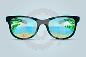 Summer sunglasses with beach reflection photo