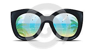 Summer sunglasses with a reflection of a tropical beach