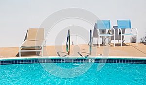 summer sunlounger at the swimming pool. vacation concept