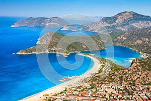 Summer sunny day in blue lagoon surrouded by mountains, Oludeniz Turkey