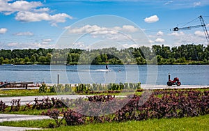 Summer sunny day.River view with water skiing ring cable car.