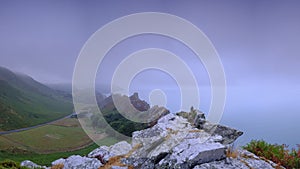 Summer sunrise with a clearing sea mist over the Valley of Rocks, near Lynton on the North Devon coast within the Exmoor National