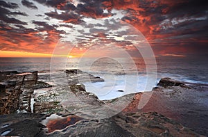 Summer sunrise over Maroubra and reflections