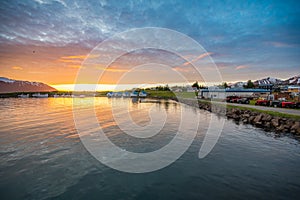 Summer sunset in at the coast of the village on island of Hrisey in Iceland