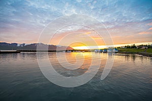 Summer sunset in at the coast of the village on island of Hrisey in Iceland