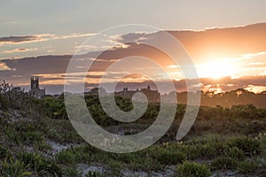 A summer sunset over dune grass in Newport, Rhode Island