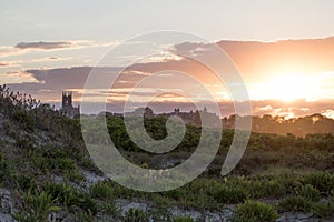 A summer sunset over dune grass in Newport, Rhode Island