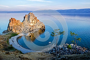 Summer sunset over Rock of Shamanka Burhan on Olkhon Island in Lake Baikal, Russia