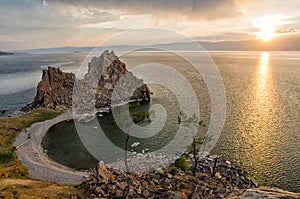 Summer sunset over Rock of Shamanka Burhan on Olkhon Island in Lake Baikal, Russia