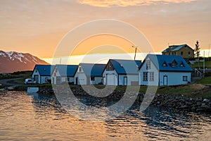 Summer sunset in the village on island of Hrisey in Iceland