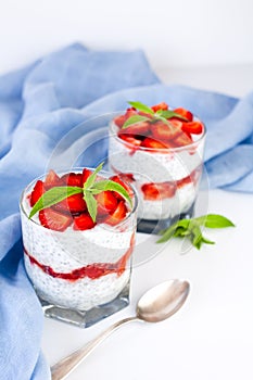 Summer tasty dessert with fresh strawberry, yogurt and chia seeds. Diet breakfast. Ð¡lose-up