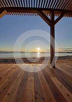 summer terrace on the beach at sunset