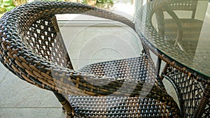 Summer terrace with wooden chairs and tables.